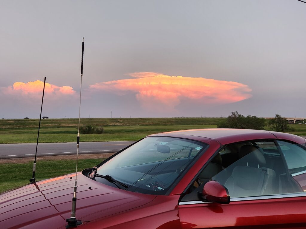KJ5APW's car parked in front of a neat cloud formation.